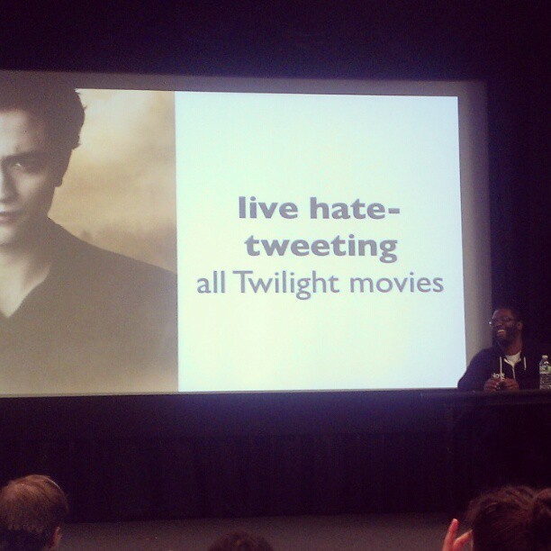 Baratunde presenting a slide saying "live hate-tweeting all Twilight movies"